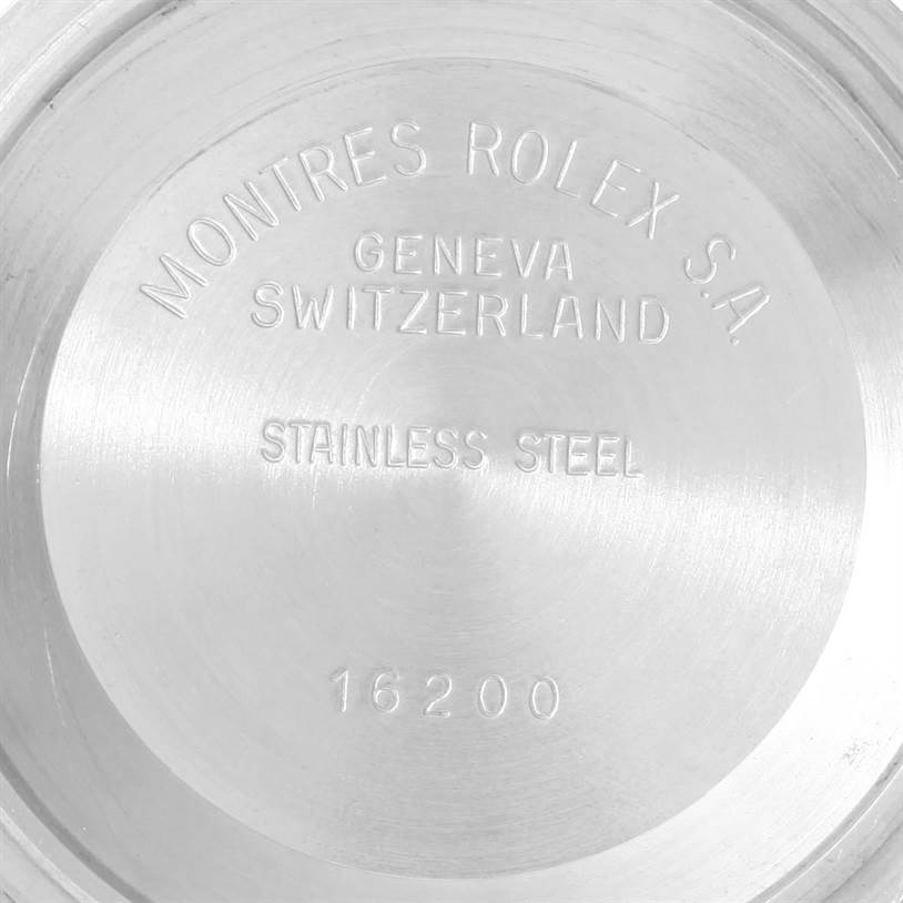 The image shows the back case of a Rolex Datejust 16233 Men's Steel and Gold (two tone) Beige Dial 16233 Men's Steel and Gold (two tone) Beige Dial watch model 16200, displaying the inscriptions and material.