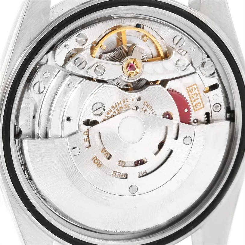 The image shows the intricate internal movement mechanism of the Rolex Datejust 16200 Men
s Stainless Steel Silver Dial 16200 Men
s Stainless Steel Silver Dial watch viewed from the back side.