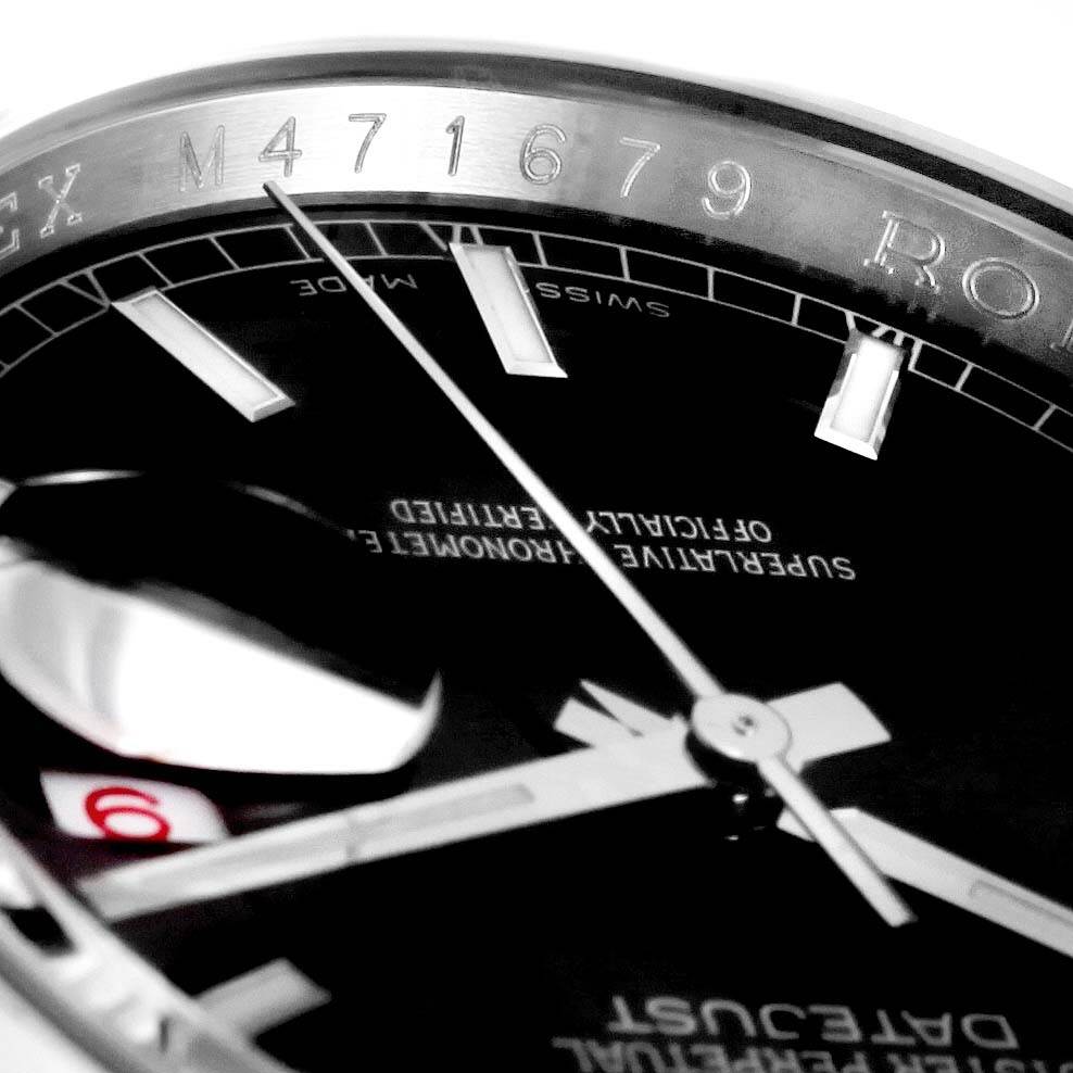 This close-up angle of the Rolex Datejust 116200 Men's Stainless Steel Black Dial 116200 Men's Stainless Steel Black Dial watch shows the dial, part of the bezel, and the hands, including partial minute and hour markers.
