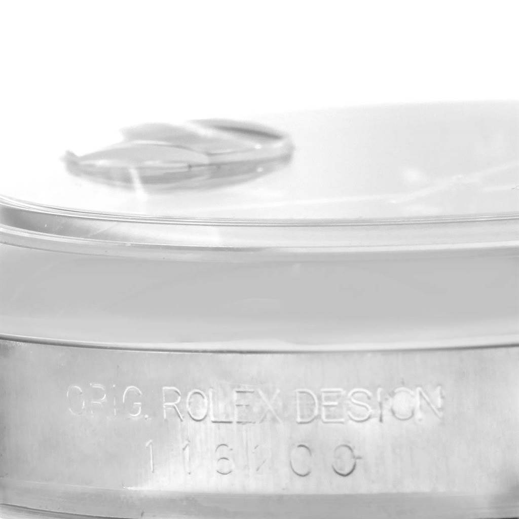 This image shows a close-up of the case side of a Rolex Datejust 116200 Men's Stainless Steel Black Dial 116200 Men's Stainless Steel Black Dial watch, displaying the engraved model number and design text.