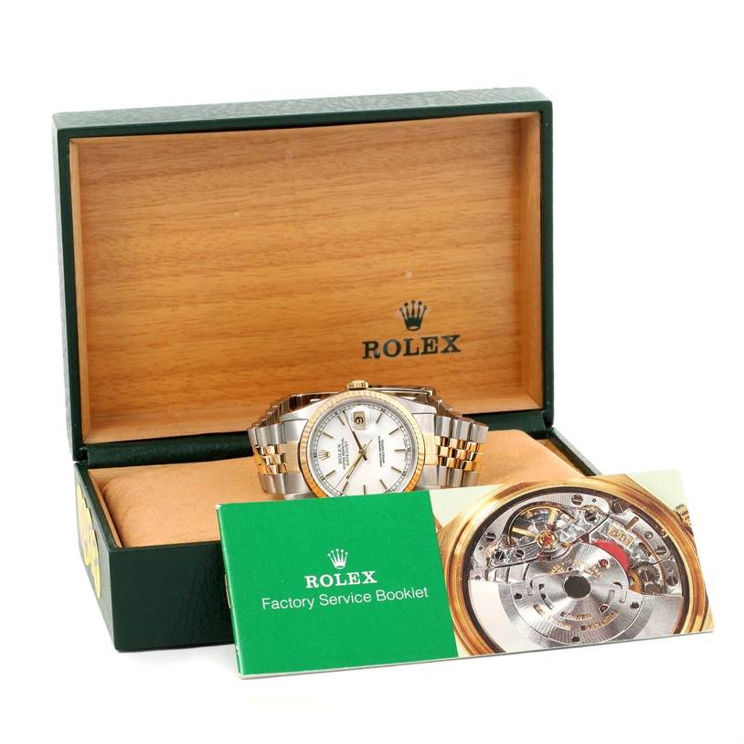 The image shows a Rolex Datejust 16233 Men's Steel and Gold (two tone) White Dial 16233 Men's Steel and Gold (two tone) White Dial watch placed inside a green Rolex box with a Factory Service Booklet positioned in front.