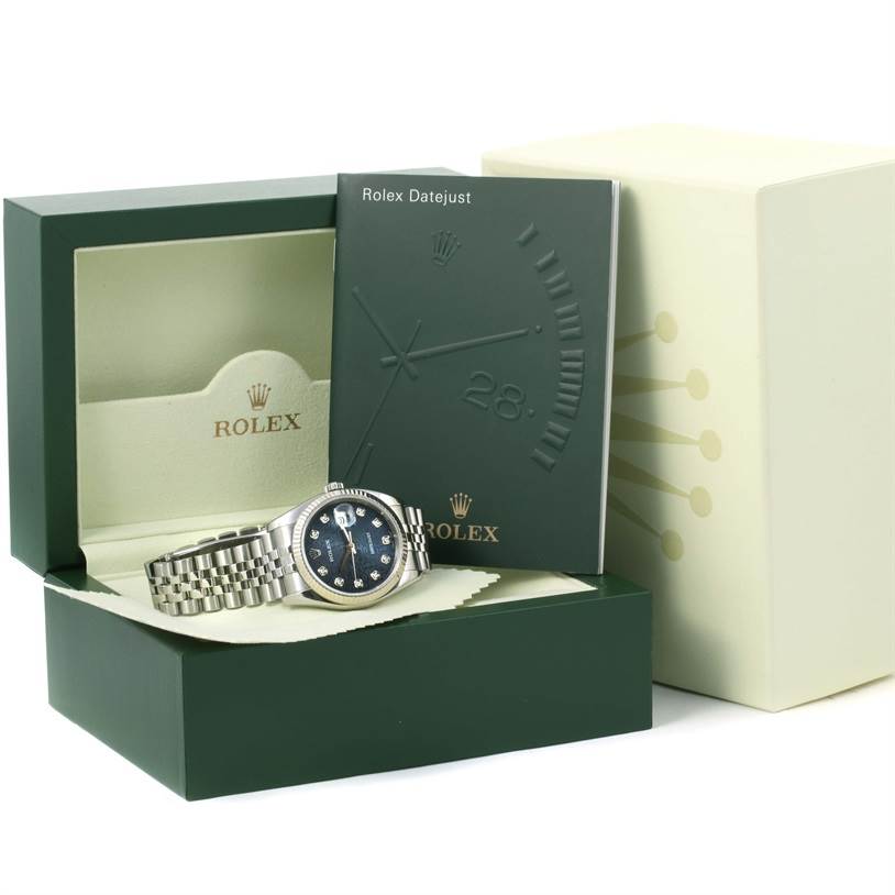 The image shows a Rolex Datejust 116234 Men's Stainless Steel Blue Dial 116234 Men's Stainless Steel Blue Dial watch, open box, cover, and booklet with the watch's face and bracelet.