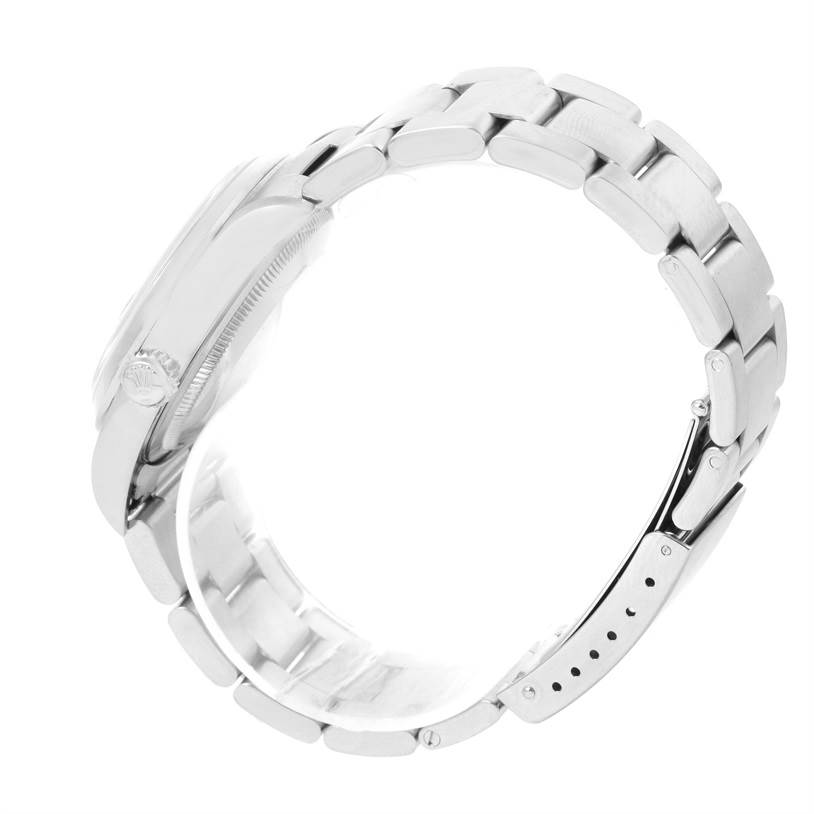 This side-angle view of the Rolex Datejust 16200 Men's Stainless Steel Blue Dial 16200 Men's Stainless Steel Blue Dial watch highlights the side of the case and the metal bracelet, including the clasp.