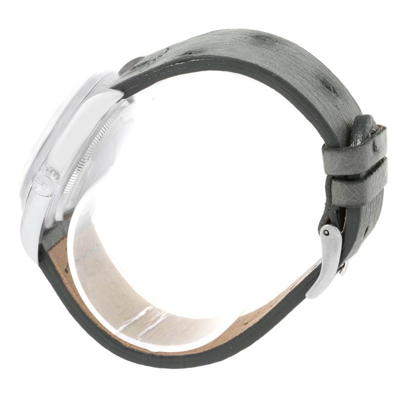 This is a side view of a Rolex Datejust 16200 Men's Stainless Steel Silver Dial 16200 Men's Stainless Steel Silver Dial watch showing the case, bezel, crown, and leather strap.