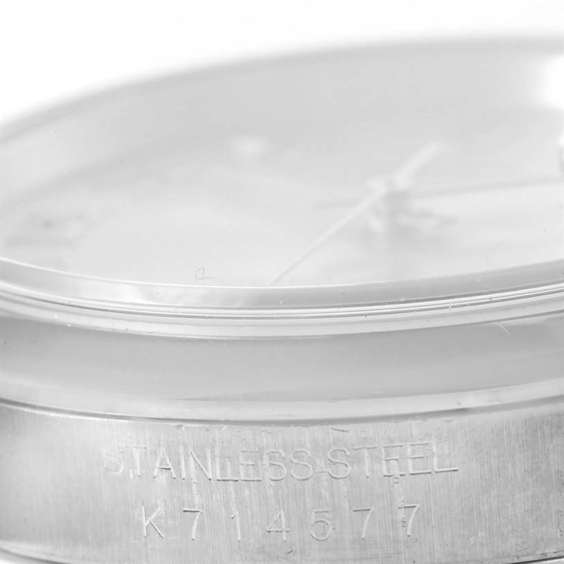 The image shows a close-up, side view of the stainless steel casing of a Rolex Datejust 16200 Men's Stainless Steel Silver Dial 16200 Men's Stainless Steel Silver Dial watch, highlighting the engraving.