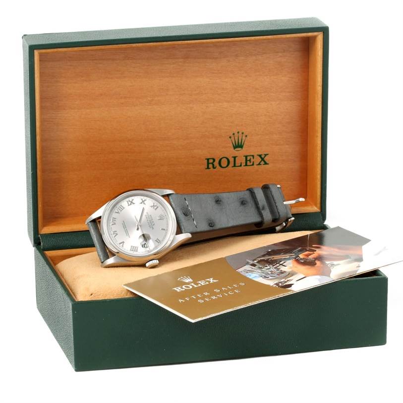 The photo shows a Rolex Datejust 16200 Men's Stainless Steel Silver Dial 16200 Men's Stainless Steel Silver Dial watch inside an open green and wooden box with accompanying booklets.