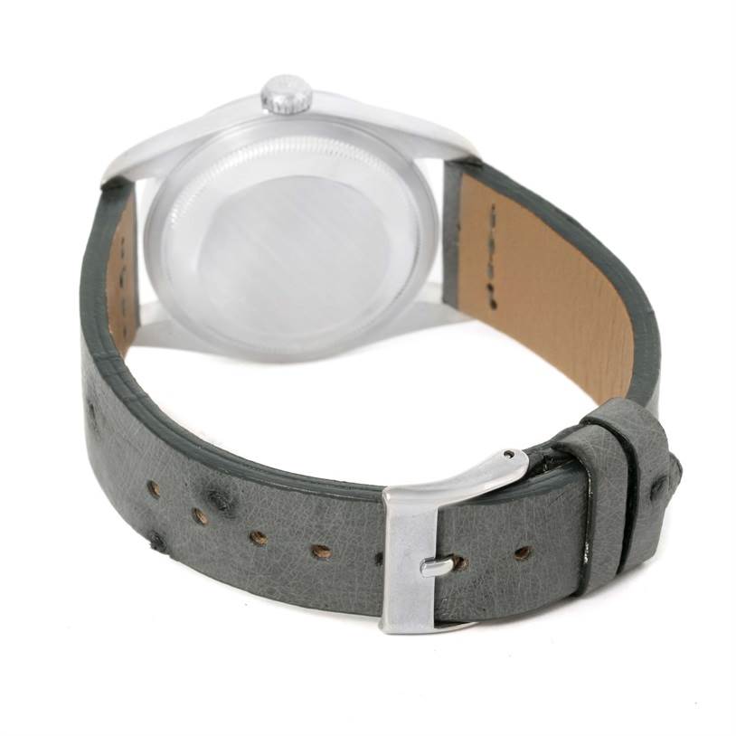 The image shows the back view of a Rolex Datejust 16200 Men's Stainless Steel Silver Dial 16200 Men's Stainless Steel Silver Dial watch with its case, crown, and strap with buckle visible.