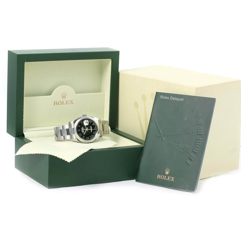 The Rolex Datejust 116200 Men's Stainless Steel Black Dial 116200 Men's Stainless Steel Black Dial watch is shown at an angle in an open box with its booklet beside it.