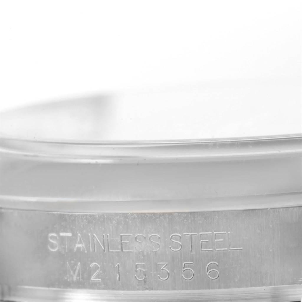 This image shows a close-up view of the stainless steel case back with the model number of a Rolex Datejust 116200 Men's Stainless Steel Black Dial 116200 Men's Stainless Steel Black Dial.