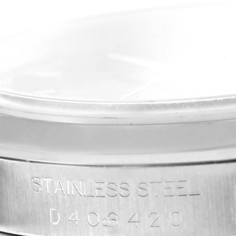This image shows a close-up of the side view of the Rolex Datejust 16200 Men
s Stainless Steel Black Dial 16200 Men
s Stainless Steel Black Dial, highlighting the stainless steel casing and serial number.