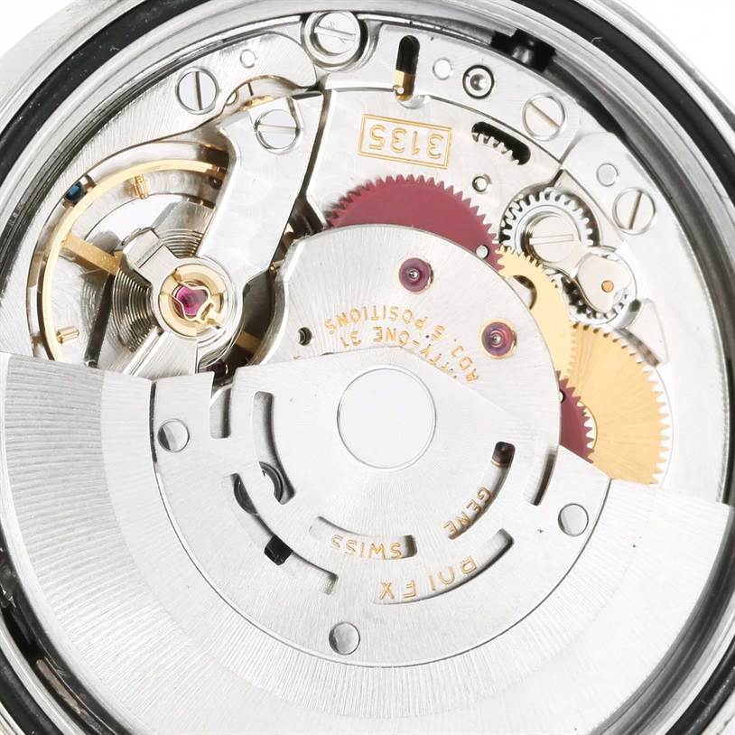 The image shows an open back view of the mechanical movement of a Rolex Datejust 16200 Men
s Stainless Steel Black Dial 16200 Men
s Stainless Steel Black Dial watch, revealing gears and the rotor.