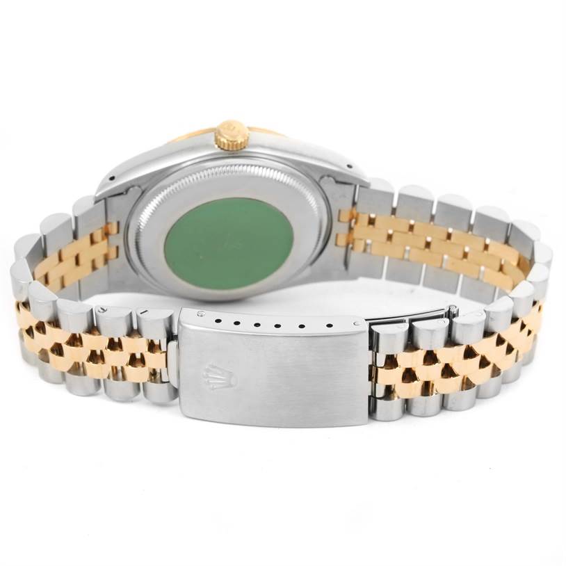 The image shows the backside and bracelet of a Rolex Datejust 15223 Men's Steel and Gold (two tone) White Dial 15223 Men's Steel and Gold (two tone) White Dial watch, featuring a two-tone metal design and a clasp with the Rolex logo.