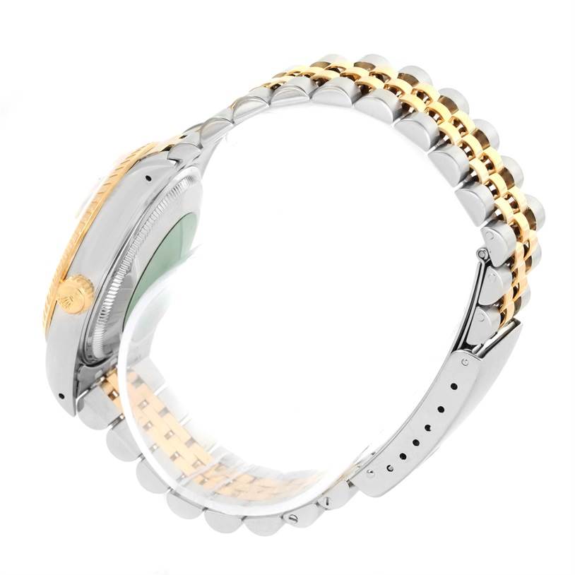 This image shows a side profile view of a Rolex Datejust 15223 Men's Steel and Gold (two tone) White Dial 15223 Men's Steel and Gold (two tone) White Dial watch, highlighting the crown, case, and Jubilee bracelet.