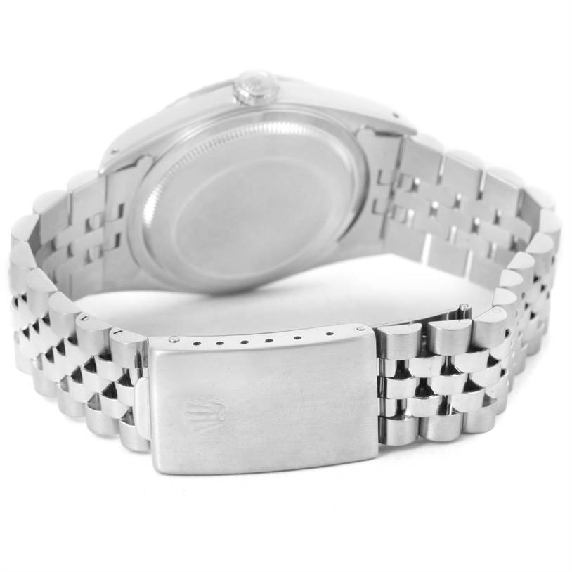 The image shows the back view of a Rolex Datejust 16220 Men
s Stainless Steel Black Dial 16220 Men
s Stainless Steel Black Dial watch, focusing on its Jubilee bracelet and clasp.