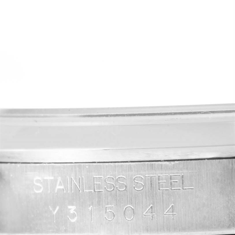 This image shows an engraving on the case of a Rolex Datejust 16200 Men
s Stainless Steel Black Dial 16200 Men
s Stainless Steel Black Dial watch, highlighting its stainless steel construction and serial number.