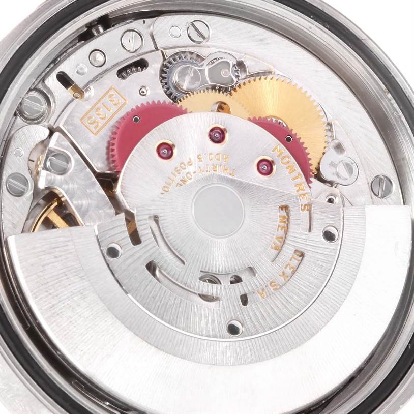 This is a close-up view of the movement mechanism of a Rolex Datejust 16200 Men
s Stainless Steel Black Dial 16200 Men
s Stainless Steel Black Dial watch, highlighting gears and intricate components.