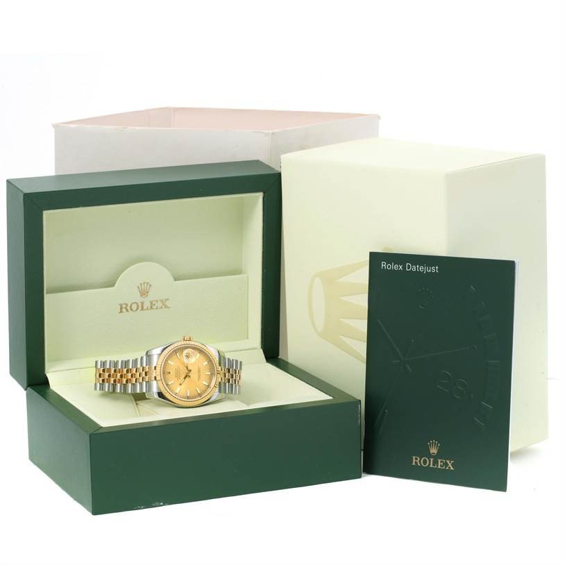 The Rolex Datejust 116233 Men's Stainless Steel Champagne Dial 116233 Men's Stainless Steel Champagne Dial watch is shown in its open case with the box and user manual displayed nearby.