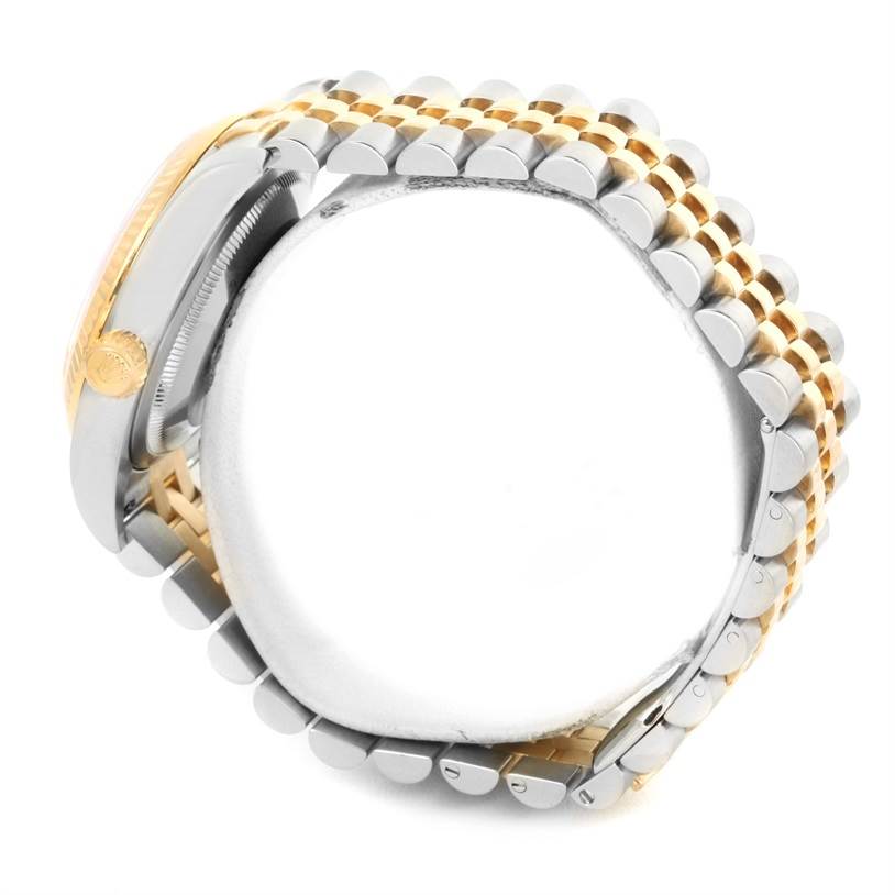 The image shows a side view of a Rolex Datejust 116233 Men's Stainless Steel Champagne Dial 116233 Men's Stainless Steel Champagne Dial watch focusing on the crown and two-tone bracelet.