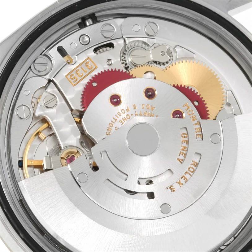 The image shows an internal view of the Rolex Datejust 16234 Men
s Stainless Steel White Dial 16234 Men
s Stainless Steel White Dial movement and gears from the back of the watch.