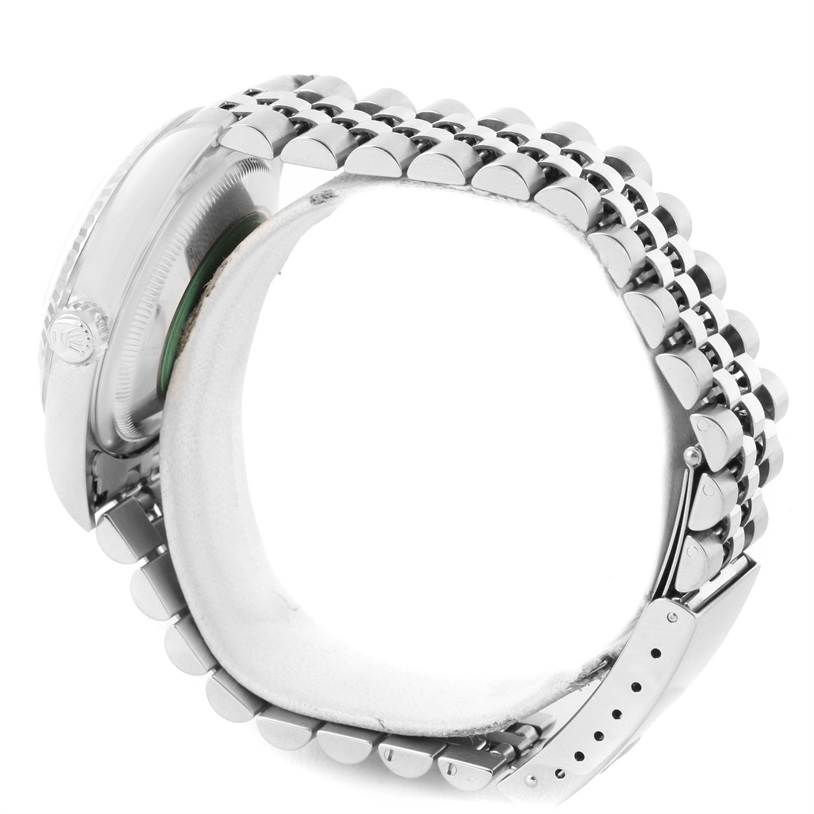 The image shows a side view of a Rolex Datejust 16234 Men
s Stainless Steel White Dial 16234 Men
s Stainless Steel White Dial watch focusing on its bracelet and case, displaying the crown and a partial view of the clasp.