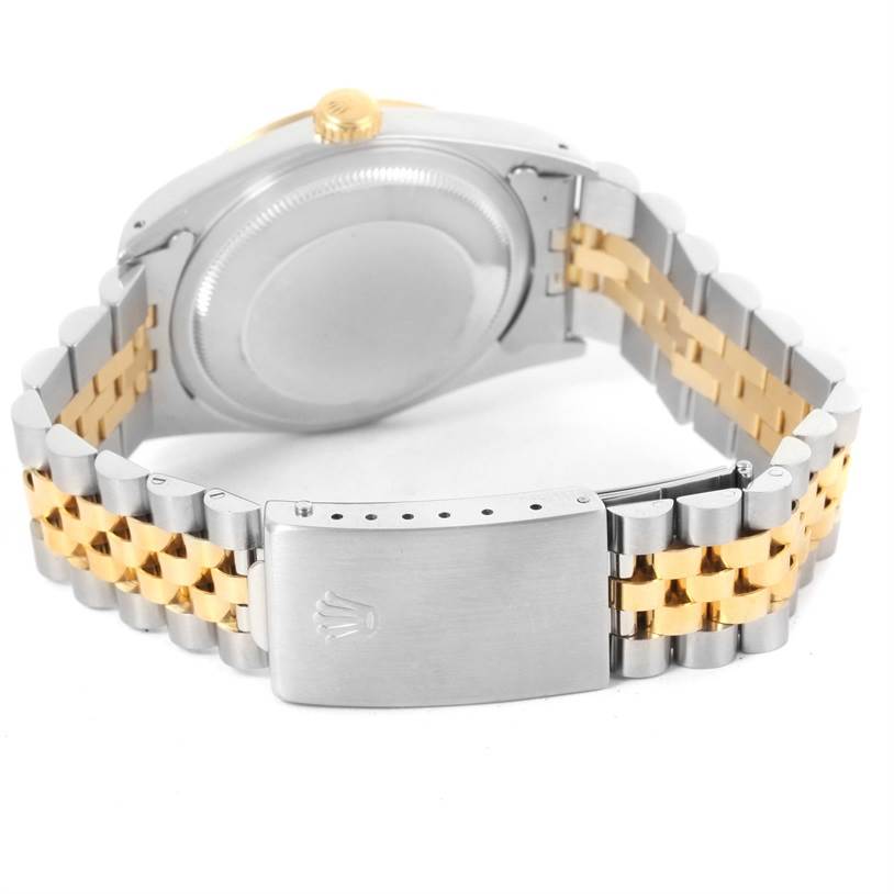 This image shows the case back and bracelet of the Rolex Datejust 16233 Men's Steel and Gold (two tone) Champagne Dial 16233 Men's Steel and Gold (two tone) Champagne Dial, including the clasp with the Rolex logo.