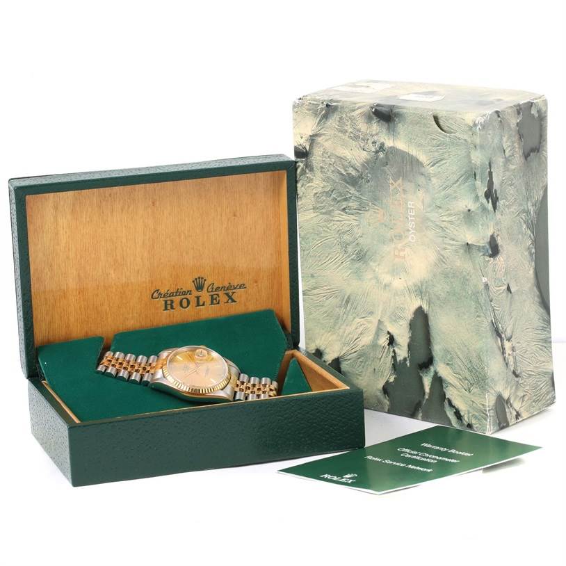 This image shows a Rolex Datejust 16233 Men's Steel and Gold (two tone) Champagne Dial 16233 Men's Steel and Gold (two tone) Champagne Dial watch, packaging box, outer box, and booklets from a slightly elevated front angle.