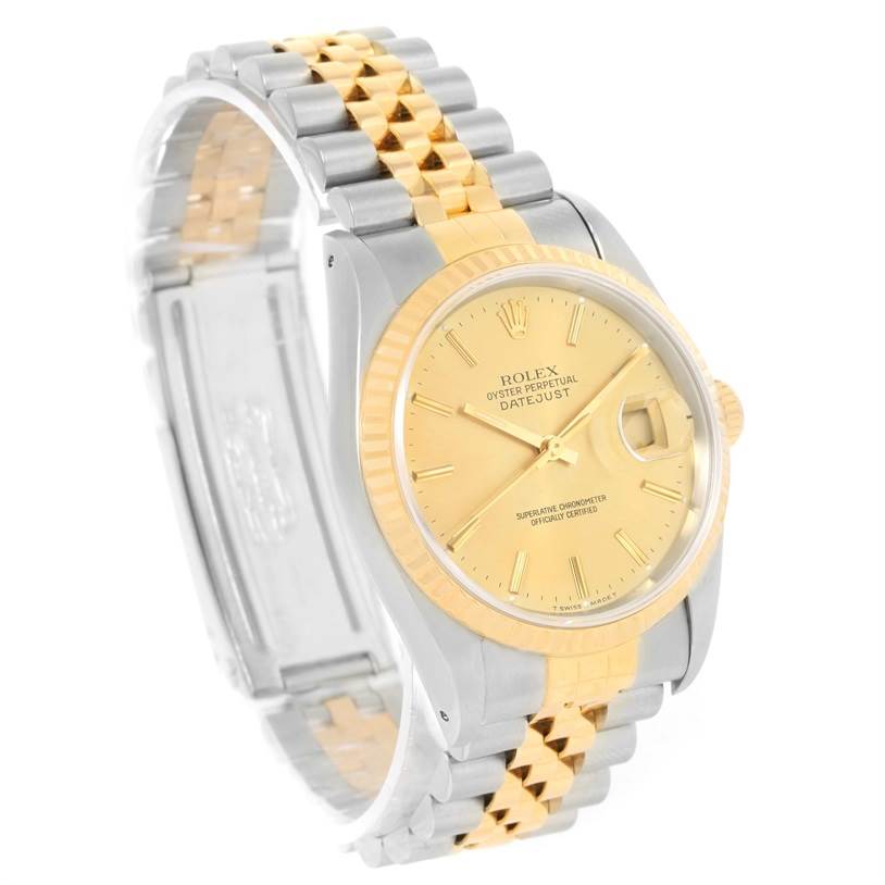 This Rolex Datejust 16233 Men's Steel and Gold (two tone) Champagne Dial 16233 Men's Steel and Gold (two tone) Champagne Dial watch is shown at a slight angle, highlighting its gold dial, dual-tone bracelet, and fluted bezel.