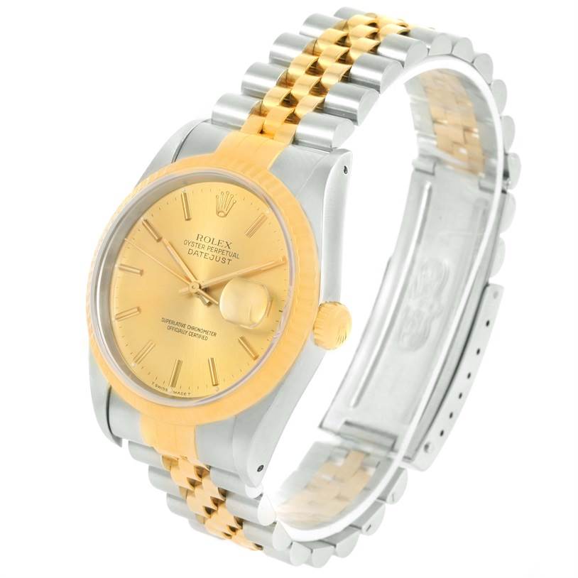 This Rolex Datejust 16233 Men's Steel and Gold (two tone) Champagne Dial 16233 Men's Steel and Gold (two tone) Champagne Dial watch is shown at a slight angle, highlighting its gold dial, bezel, and two-tone bracelet.