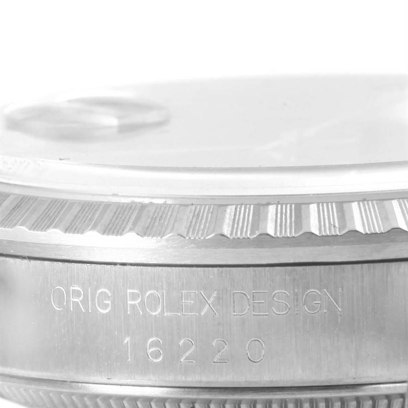 This image shows a close-up of a Rolex Datejust 16220 Men
s Stainless Steel Black Dial 16220 Men
s Stainless Steel Black Dial model
s case side, focusing on the bezel and engraved model number "16220".