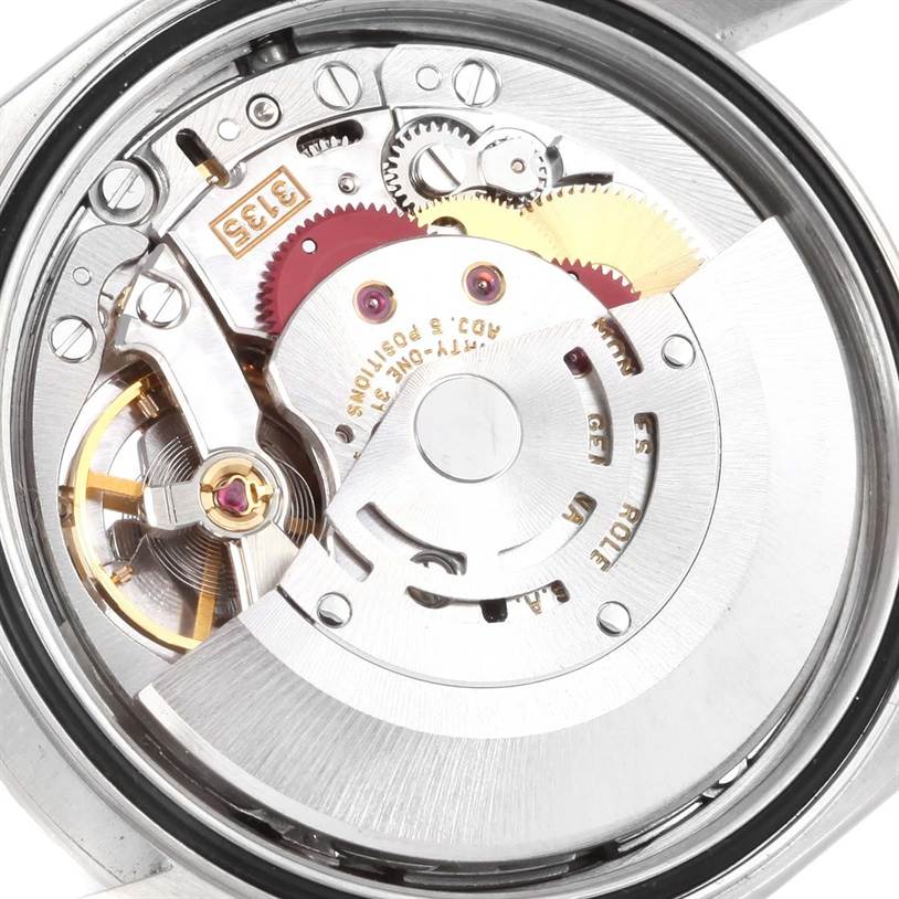 The image shows the intricate movement mechanism of the Rolex Datejust 16220 Men
s Stainless Steel Silver Dial 16220 Men
s Stainless Steel Silver Dial watch from a rear angle.