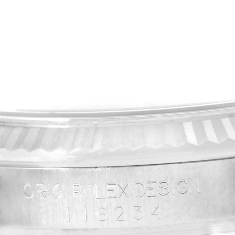 This image shows a close-up of the side bezel and engraving of a Rolex Datejust 116234 Men
s Stainless Steel Black Dial 116234 Men
s Stainless Steel Black Dial model watch.