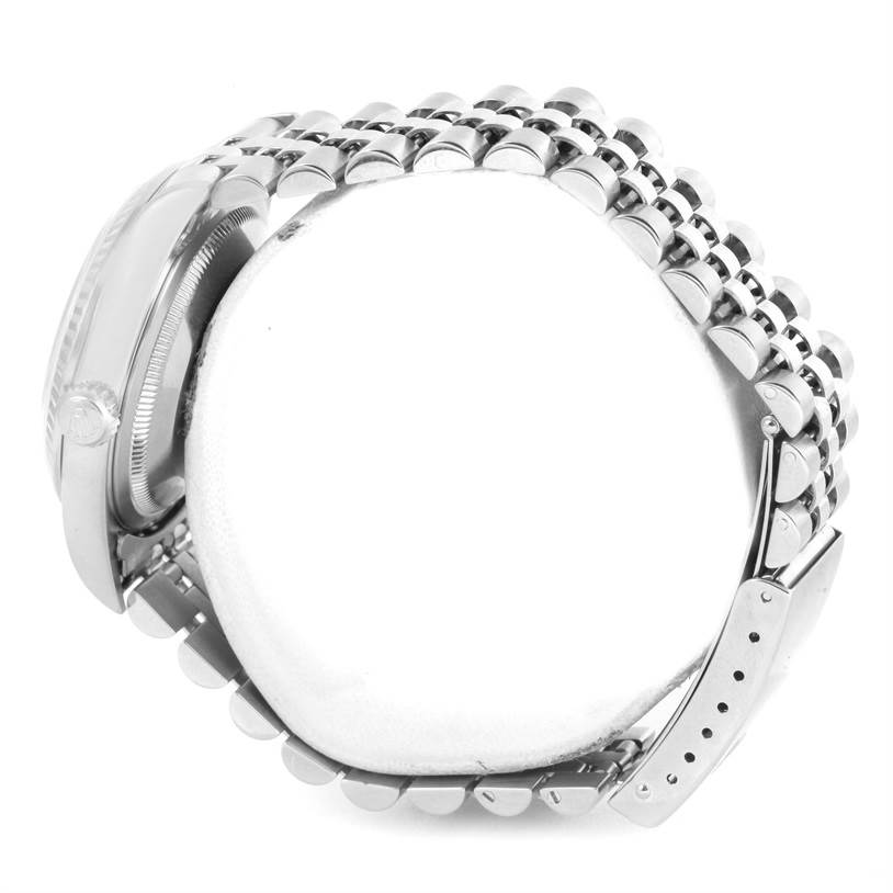 The image shows a side profile and partial view of the bracelet and clasp of a Rolex Datejust 16234 Men
s Stainless Steel White Dial 16234 Men
s Stainless Steel White Dial watch.