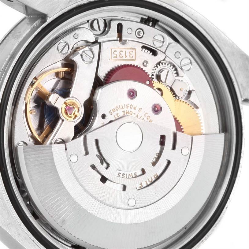The image shows the internal movement and mechanism of a Rolex Datejust 116234 Men
s Stainless Steel Black Dial 116234 Men
s Stainless Steel Black Dial watch.