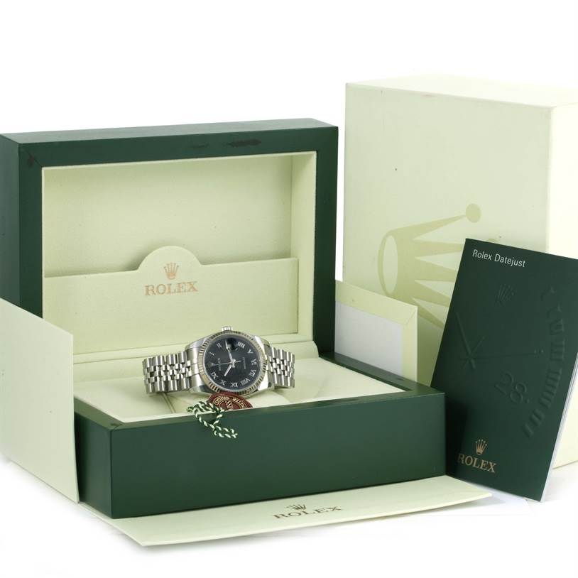 The image shows a Rolex Datejust 116234 Men
s Stainless Steel Black Dial 116234 Men
s Stainless Steel Black Dial watch in its open box with its documentation and tags visible.