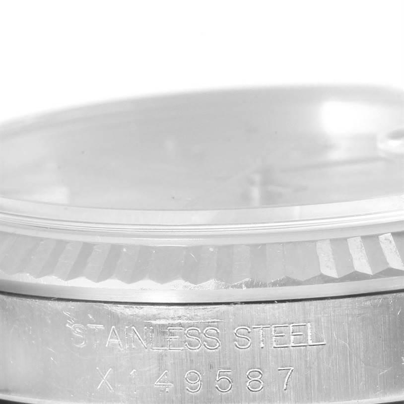 The image shows a close-up view of the bezel and case with the "STAINLESS STEEL" engraving on a Rolex Datejust 16234 Men's Stainless Steel Silver Dial 16234 Men's Stainless Steel Silver Dial watch.