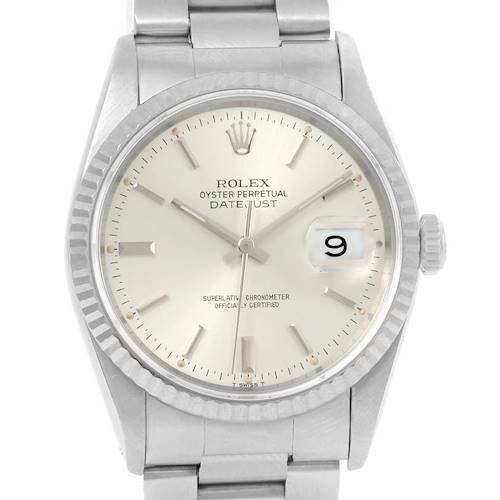 This image shows a Rolex Datejust watch with a silver dial, fluted bezel, and Oyster bracelet, viewed from the front.