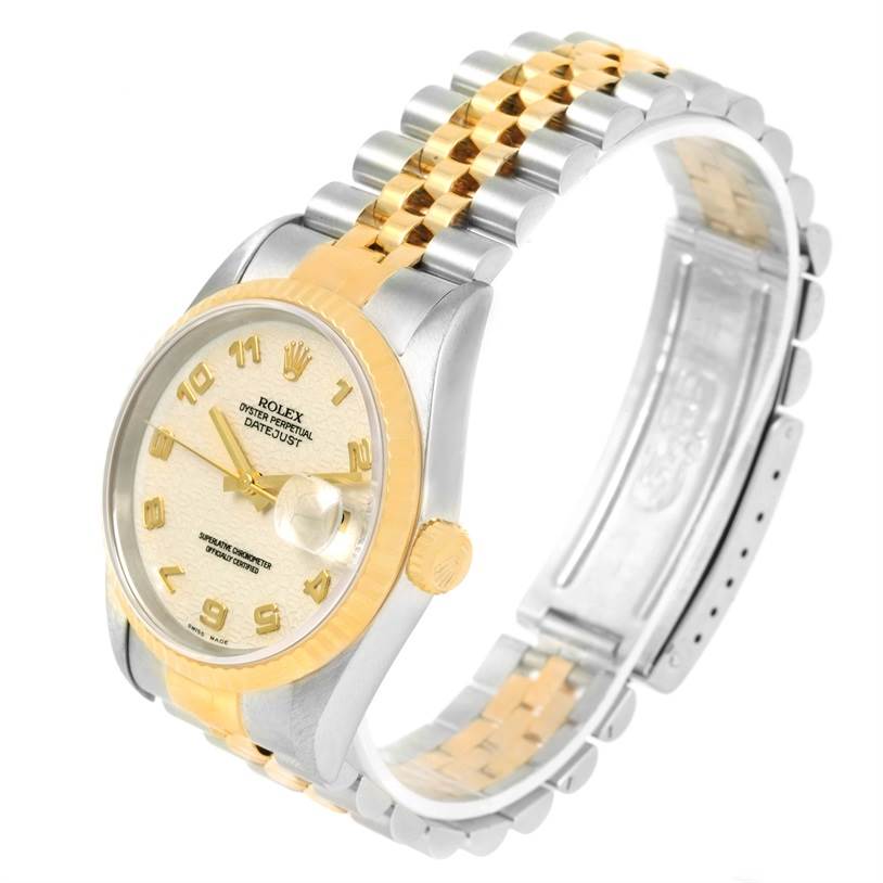The Rolex Datejust 16233 Men
s Steel and Gold (two tone) Beige Dial 16233 Men
s Steel and Gold (two tone) Beige Dial watch is shown at an angle highlighting the dial, crown, bezel, and two-tone bracelet.