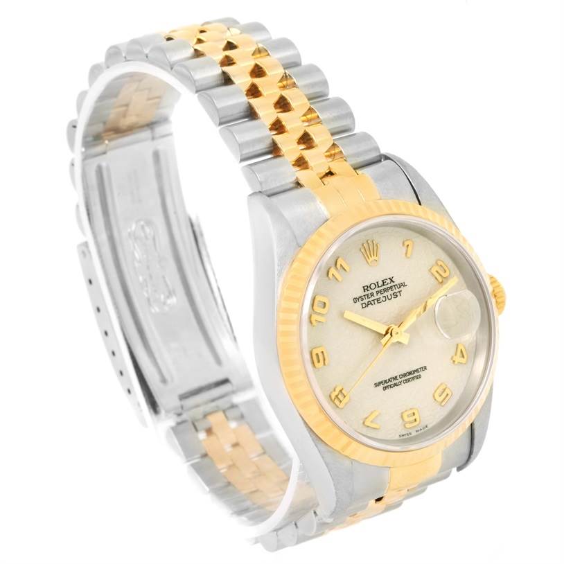 This image shows a Rolex Datejust 16233 Men
s Steel and Gold (two tone) Beige Dial 16233 Men
s Steel and Gold (two tone) Beige Dial watch, angled to display the dial, bezel, and two-tone bracelet.