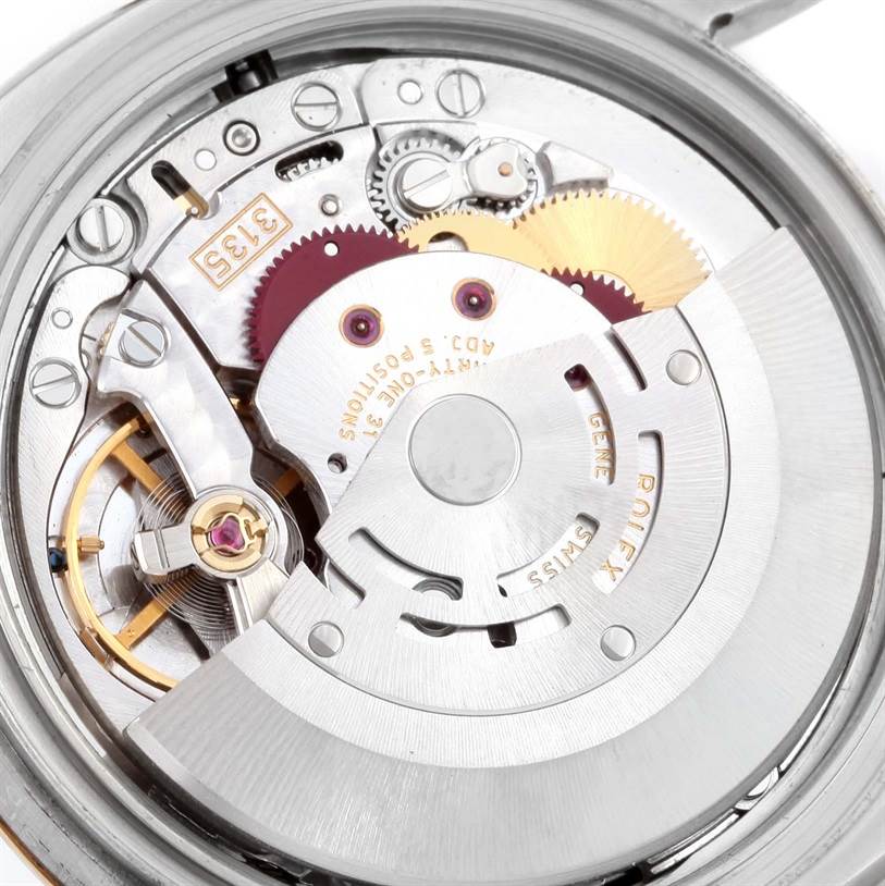 The image shows the internal mechanism and movement parts of the Rolex Datejust 116233 Men
s Stainless Steel Black Dial 116233 Men
s Stainless Steel Black Dial watch from a close-up angle.