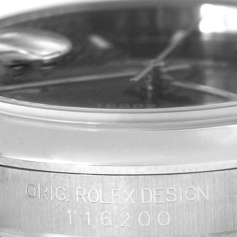 This image shows a close-up side view of the Rolex Datejust 116200 Men
s Stainless Steel Black Dial 116200 Men
s Stainless Steel Black Dial watch, focusing on the case with the model number "116200."
