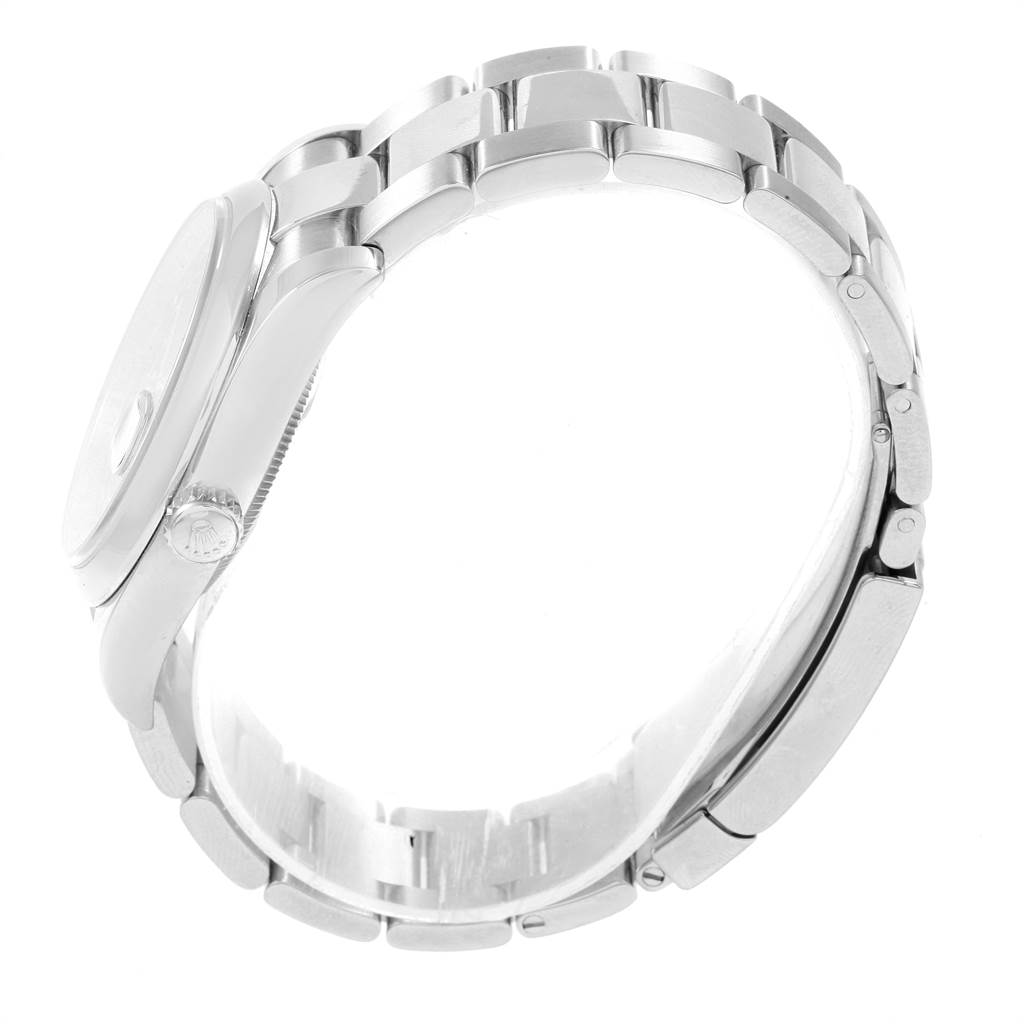 The image shows a side view of a Rolex Datejust 116200 Men
s Stainless Steel Black Dial 116200 Men
s Stainless Steel Black Dial watch, highlighting the case, crown, and partially open bracelet.