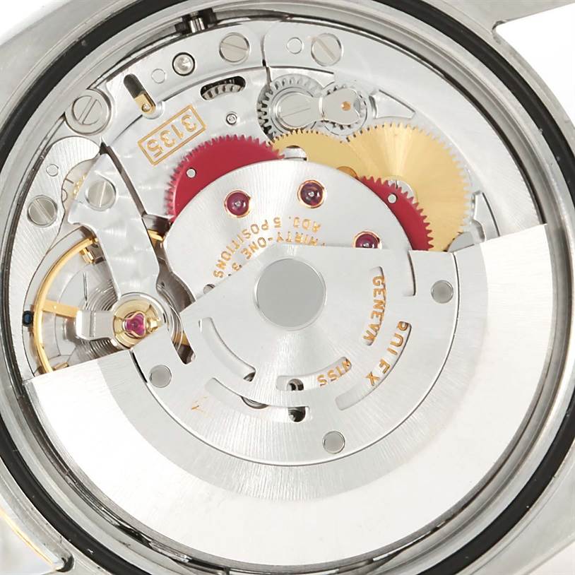The image shows a close-up view of the movement mechanism of a Rolex Datejust 116203 Men's Stainless Steel Black Dial 116203 Men's Stainless Steel Black Dial watch.