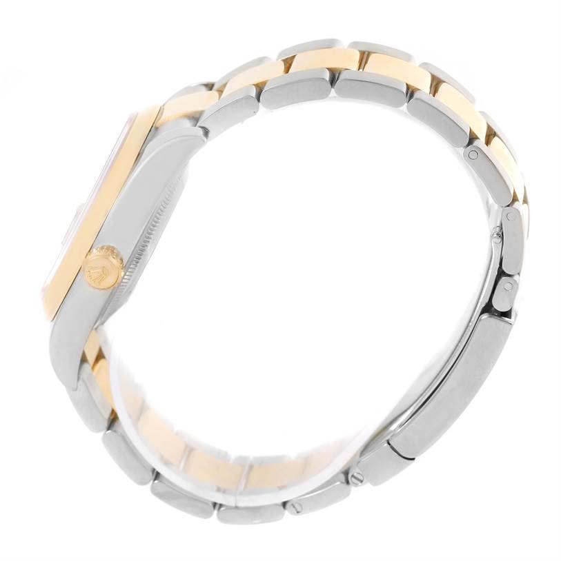 The image shows a side angle of a Rolex Datejust 116203 Men's Stainless Steel Black Dial 116203 Men's Stainless Steel Black Dial watch, highlighting its gold crown and two-tone bracelet.