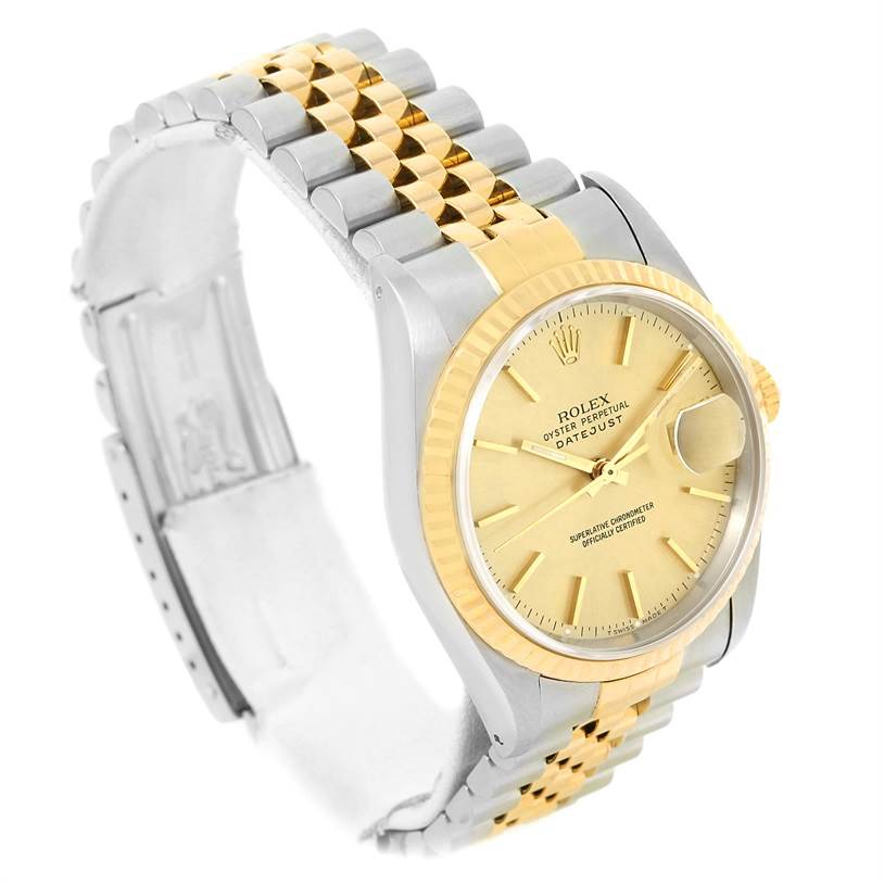 This Rolex Datejust 16233 Men's Steel and Gold (two tone) Champagne Dial 16233 Men's Steel and Gold (two tone) Champagne Dial watch is shown at an angle displaying the dial, bezel, crown, and two-tone bracelet.