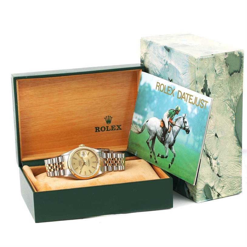 The image shows a Rolex Datejust 16233 Men's Steel and Gold (two tone) Champagne Dial 16233 Men's Steel and Gold (two tone) Champagne Dial watch from a front angle, displayed in its open green box with accompanying booklet.