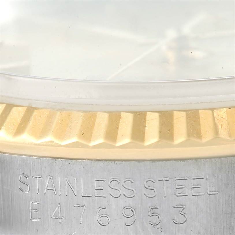 This image shows a close-up of the edge of the bezel and case, with the serial number of the Rolex Datejust 16233 Men's Steel and Gold (two tone) Champagne Dial 16233 Men's Steel and Gold (two tone) Champagne Dial watch.