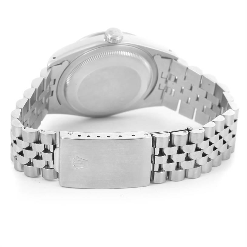 This image shows the backside and bracelet clasp of a Rolex Datejust 16234 Men's Stainless Steel Blue Dial 16234 Men's Stainless Steel Blue Dial watch at a low angle.