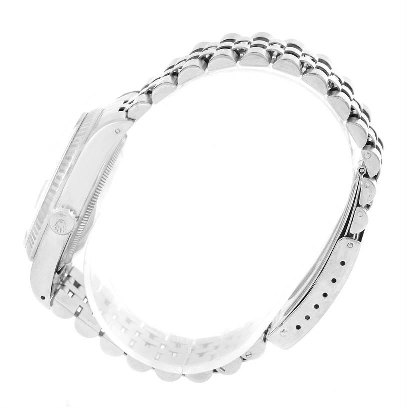 This image shows a side view of a Rolex Datejust 16234 Men's Stainless Steel Blue Dial 16234 Men's Stainless Steel Blue Dial watch, highlighting the bracelet, case, and crown.