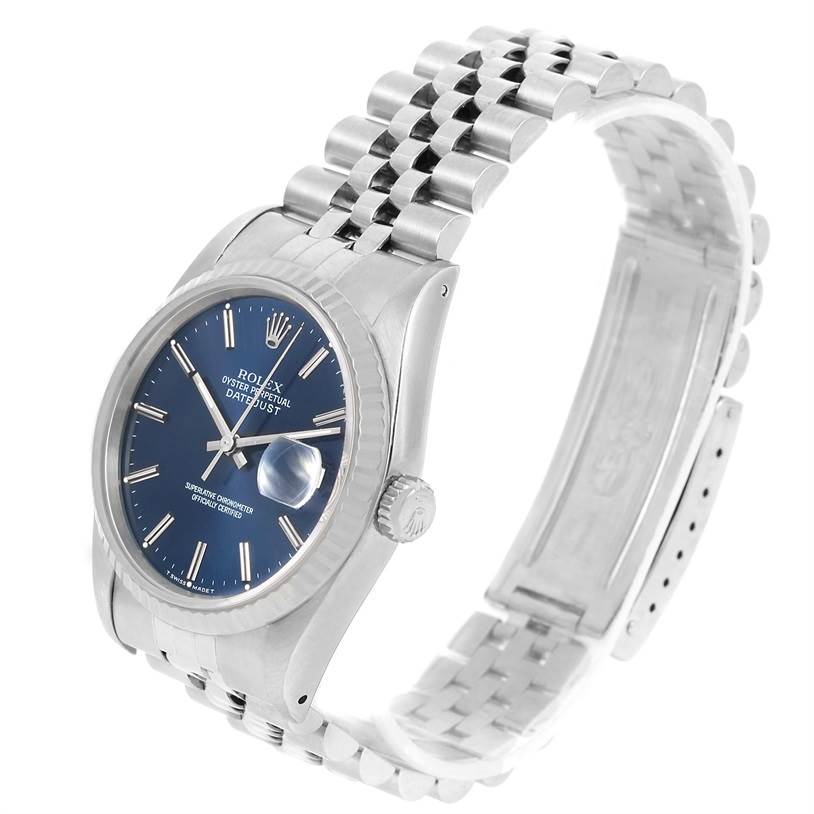 The Rolex Datejust 16234 Men's Stainless Steel Blue Dial 16234 Men's Stainless Steel Blue Dial watch is shown from a three-quarter angle, displaying the face, bezel, crown, and bracelet.