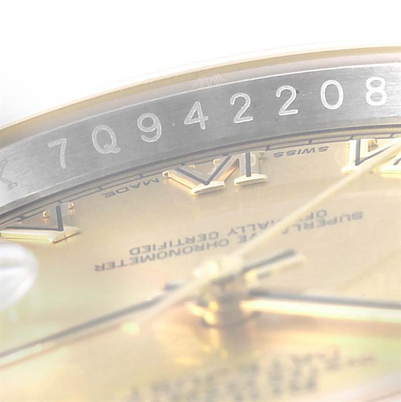 This image shows a close-up of a Rolex Datejust 116233 Men's Stainless Steel Champagne Dial 116233 Men's Stainless Steel Champagne Dial watch, focusing on the inner bezel and partial view of the dial.